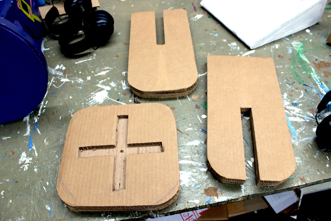 Pieces of cardboard slot together for a simple stool.